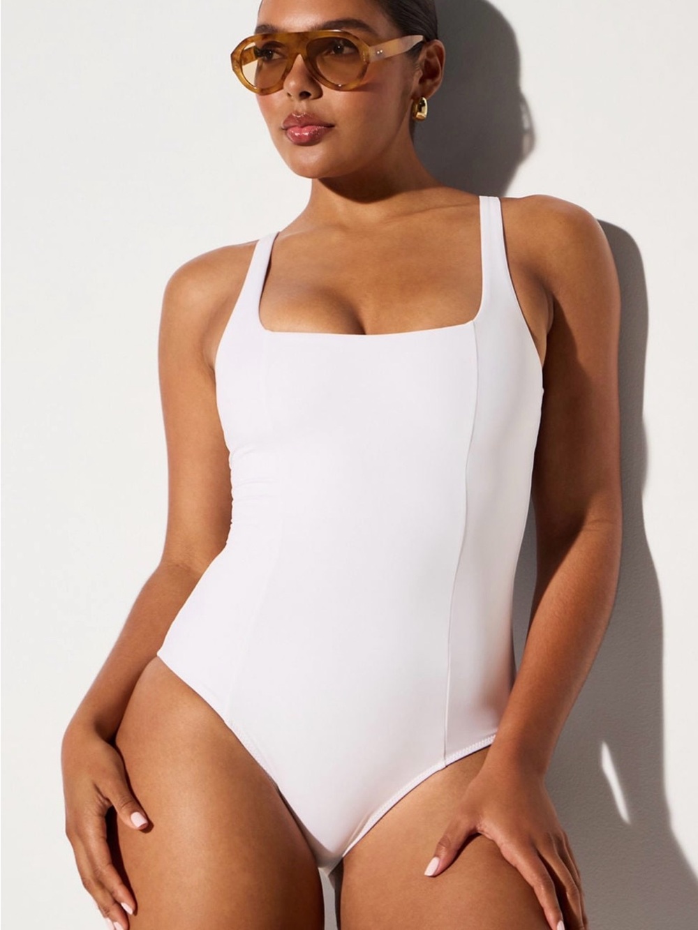 Body sculpting swim suit. Hold you in!!! Super flattering